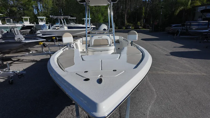 Slide: The Image of 2025 Bulls Bay 2200XS boat, front view, parked outdoors in a marina setting. - 27