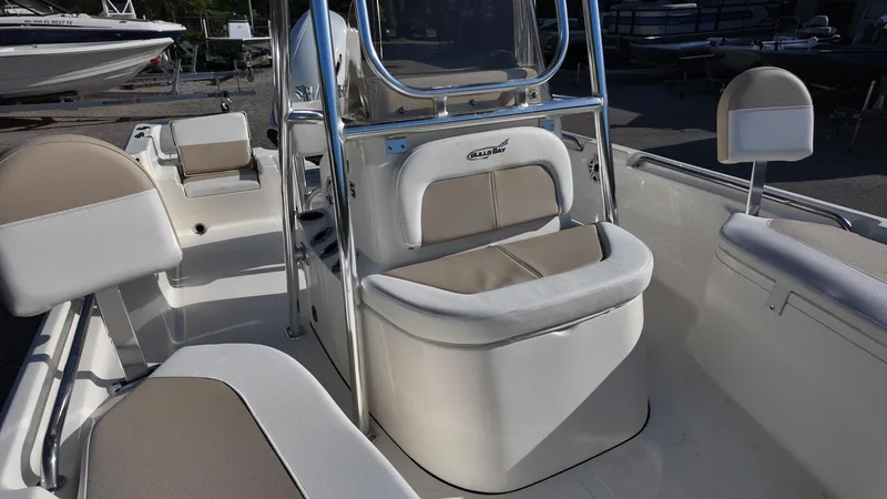 Slide: The Image of 2025 Bulls Bay 2200XS boat interior with cushioned seating and console. - 29