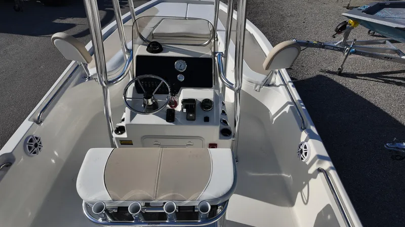 Slide: The Image of 2025 Bulls Bay 2200XS boat interior with steering console and seating. - 33