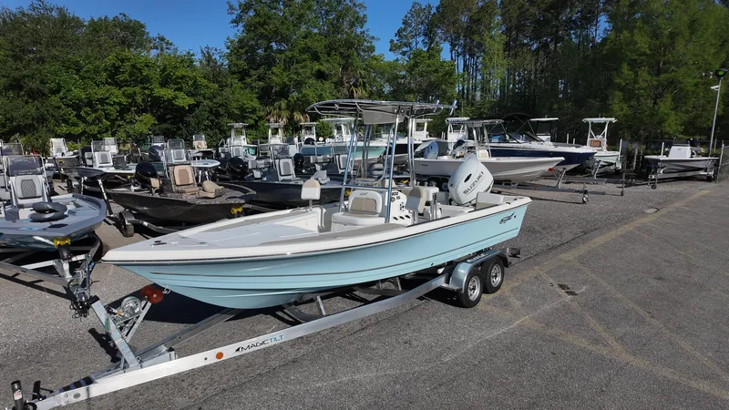 Slide: The Image of 2025 Bulls Bay 2200XS boat on trailer in a dealership lot. - 5