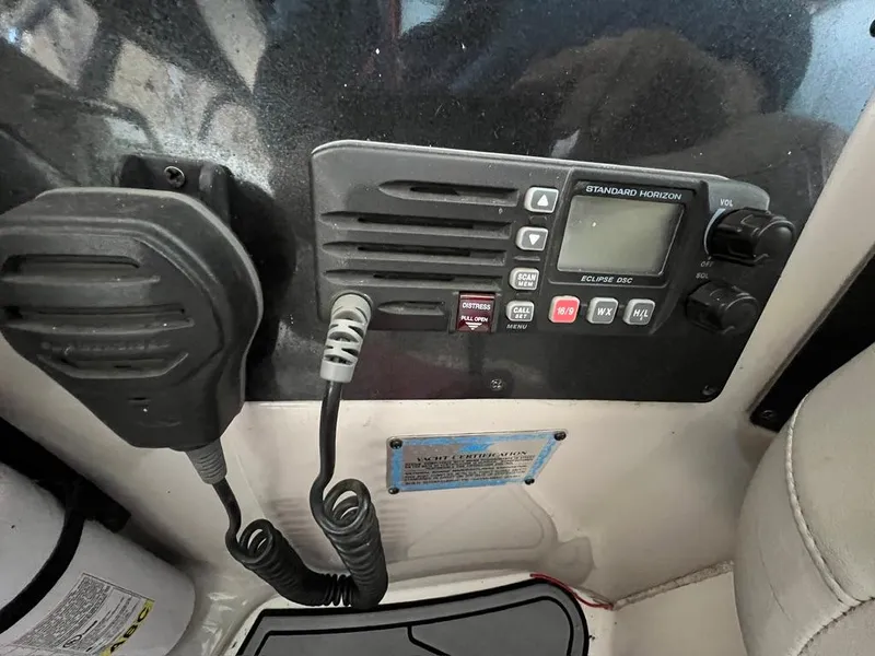 Slide: The Image of Control panel of a 2004 Doral Boca Grande 36 boat with radio equipment. - 10