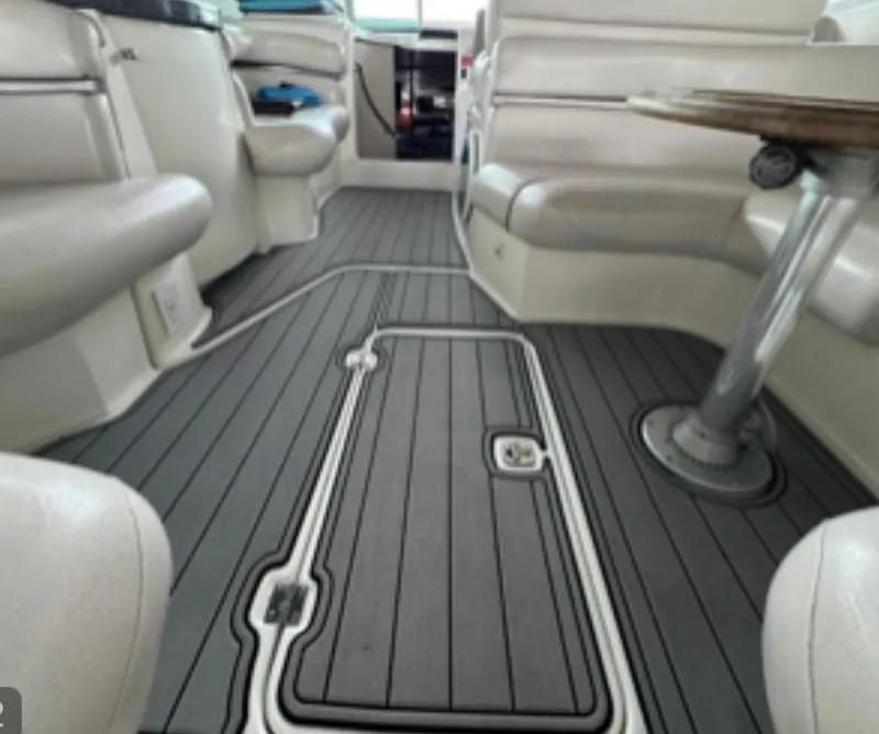 Slide: The Image of 2004 Doral Boca Grande 36 boat interior with sleek seating and modern flooring. - 13