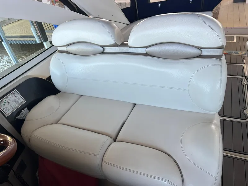 Slide: The Image of White leather seating on a 2004 Doral Boca Grande 36 boat interior. - 15