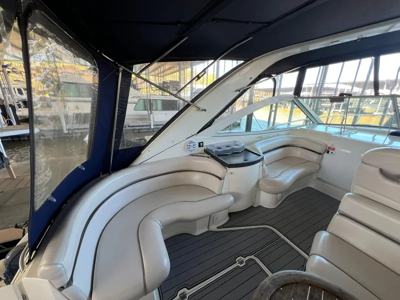 Slide: The Image of 2004 Doral Boca Grande 36 yacht interior with cushioned seating and canopy. - 19