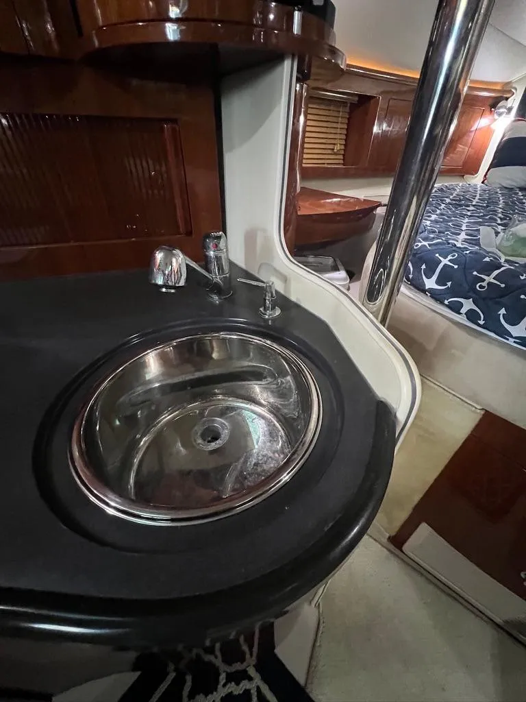 Slide: The Image of 2004 Doral Boca Grande 36 yacht interior with sink and cozy cabin. - 25