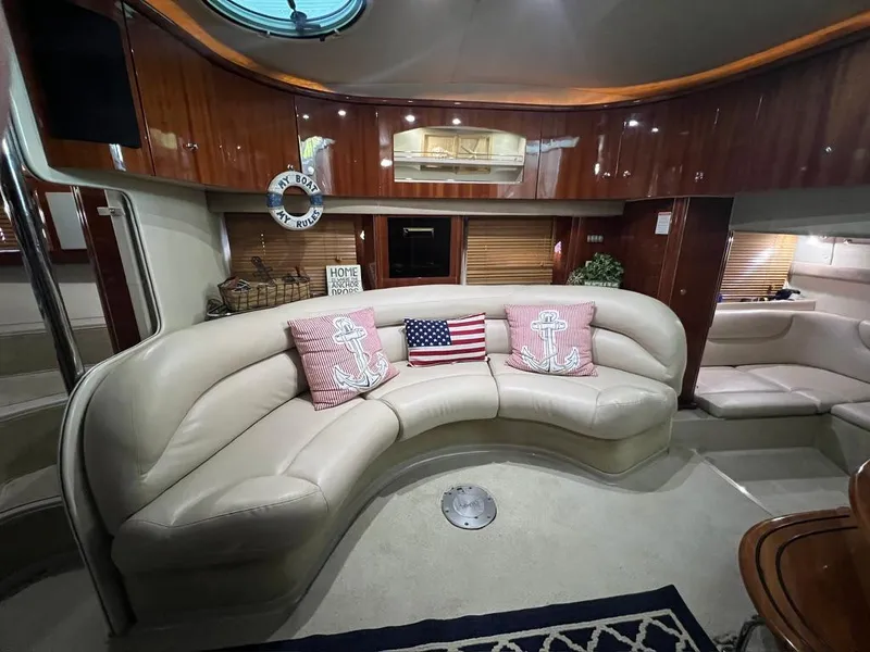 Slide: The Image of Luxurious interior of 2004 Doral Boca Grande 36 yacht with plush seating and nautical decor. - 26