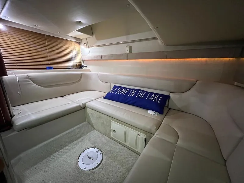 Slide: The Image of Interior of 2004 Doral Boca Grande 36 yacht with cozy seating and decorative pillow. - 27