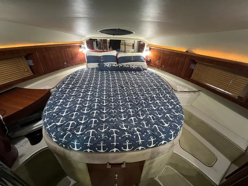 Slide: The Image of Luxurious cabin interior of 2004 Doral Boca Grande 36 with nautical-themed bedding. - 29