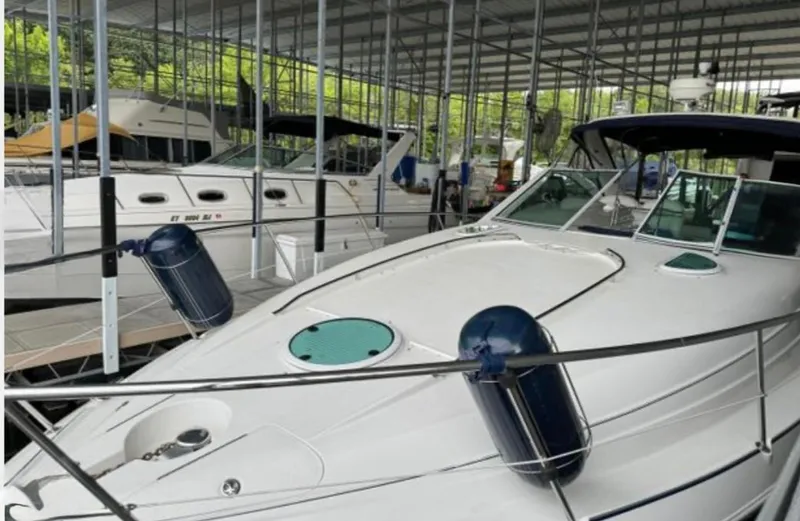 Slide: The Image of 2004 Doral Boca Grande 36 yacht docked in a covered marina. - 3