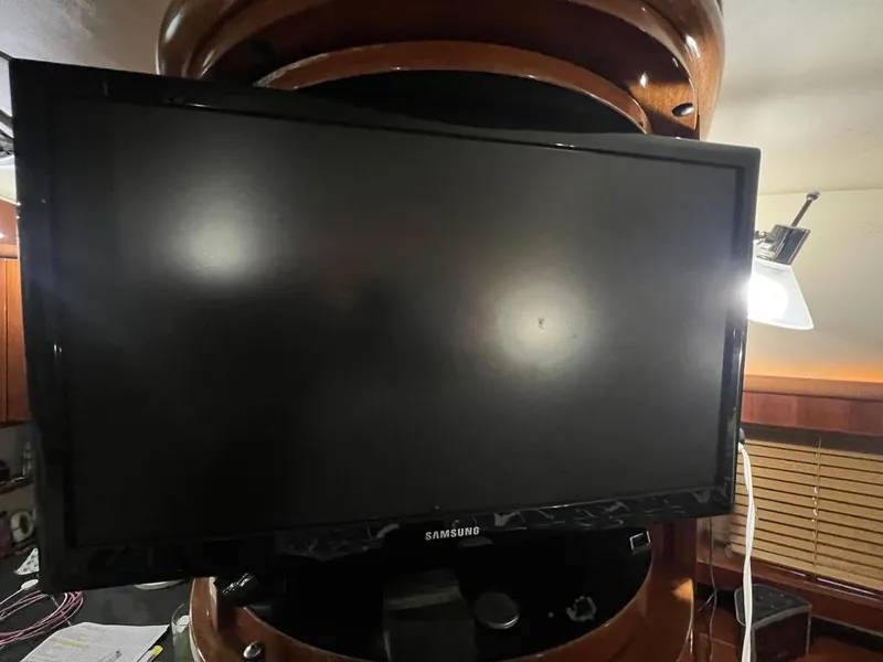 Slide: The Image of Samsung TV inside 2004 Doral Boca Grande 36 boat cabin, with wooden interior and lamp. - 31