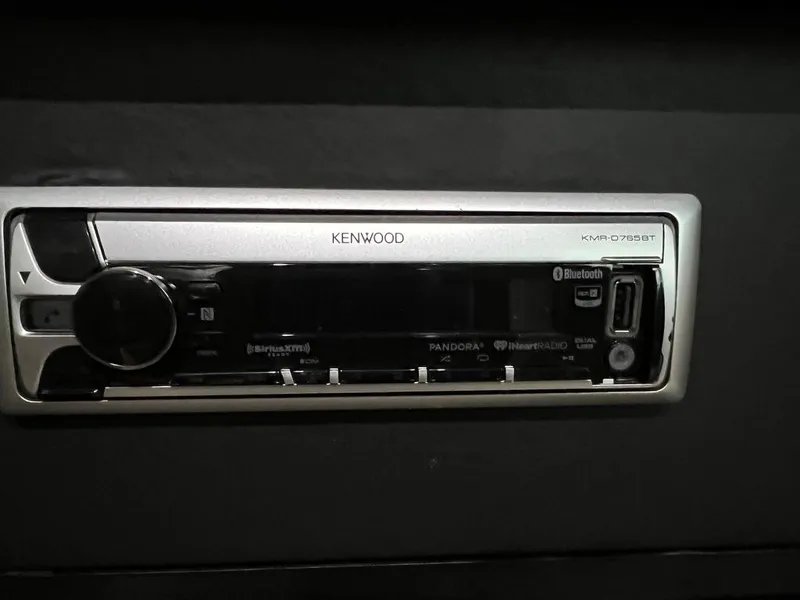 Slide: The Image of Kenwood stereo system in 2004 Doral Boca Grande 36 boat dashboard. - 32