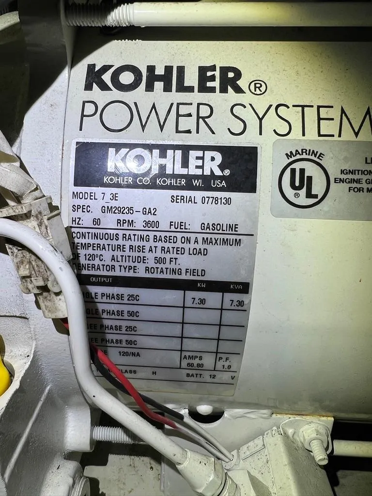 Slide: The Image of Kohler Power Systems label on a generator, model 7.3E, gasoline-fueled, for Doral Boca Grande 36. - 39