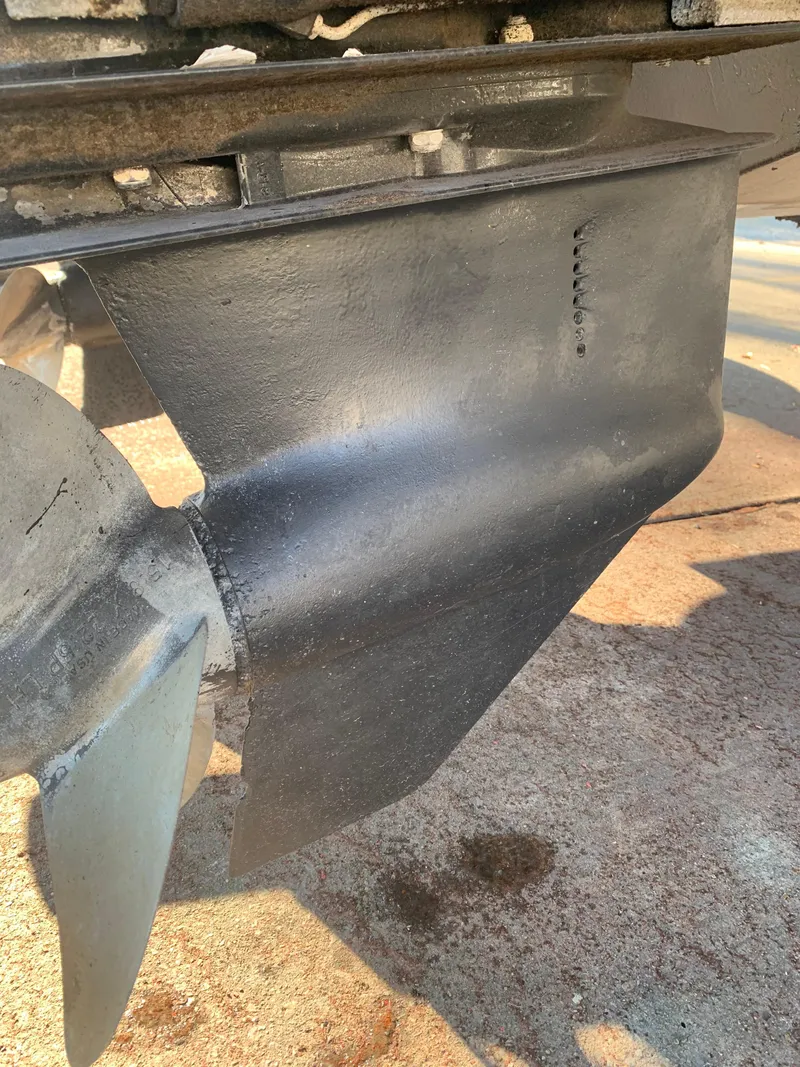 Slide: The Image of Close-up of a 2004 Doral Boca Grande 36 boat propeller and rudder. - 41