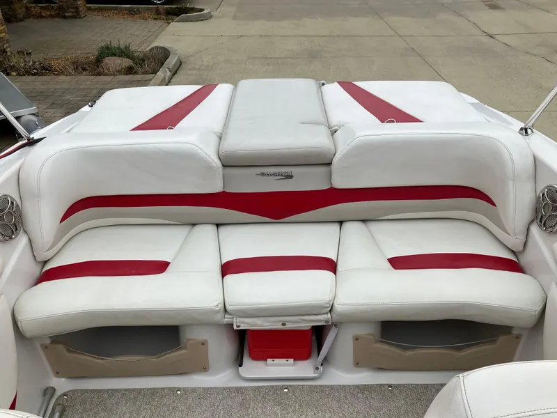 Slide: The Image of 2011 Glastron GT 205 boat interior with white and red seating. - 7
