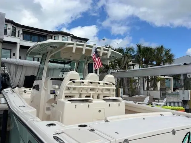 Slide: The Image of 2024 Grady-White Canyon 336 boat docked, featuring sleek design and modern amenities. - 9