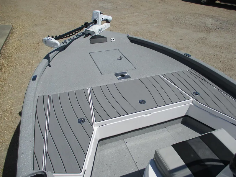 Slide: The Image of 2025 Vexus ACX 2210 boat deck with storage compartments and trolling motor. - 10