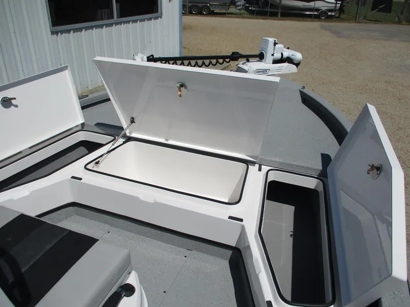 Slide: The Image of 2025 Vexus ACX 2210 boat storage compartments open, showcasing spacious interior design. - 11