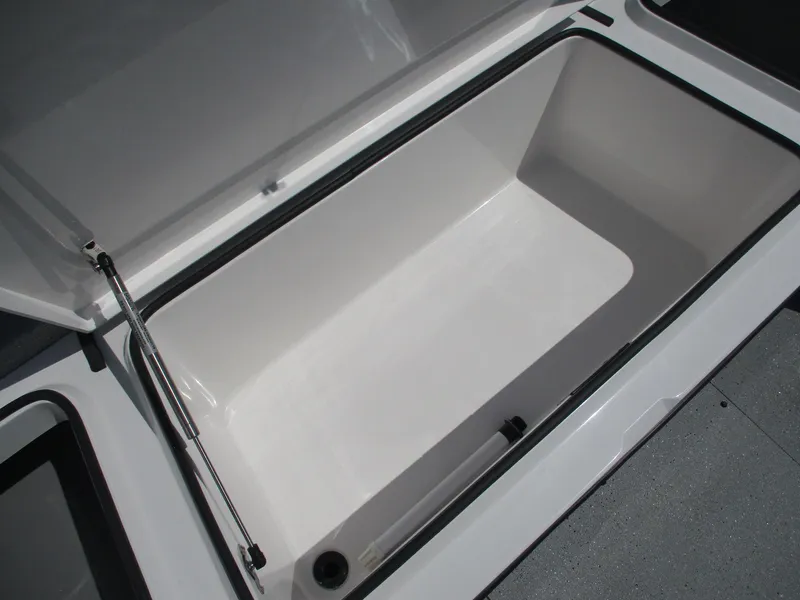 Slide: The Image of 2025 Vexus ACX 2210 boat storage compartment, open lid, spacious interior. - 12