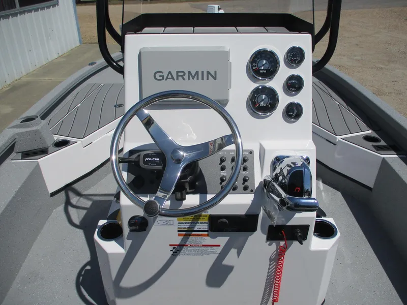 Slide: The Image of 2025 Vexus ACX 2210 boat console with Garmin navigation and steering wheel. - 13