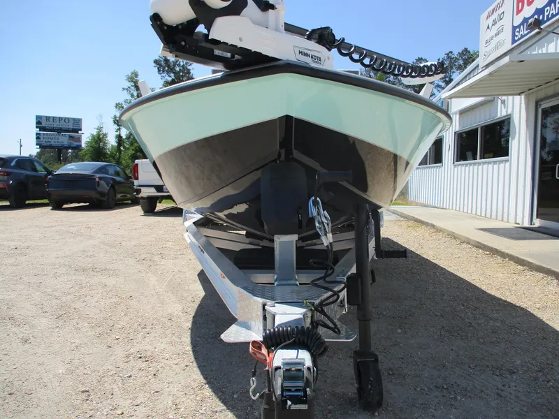Slide: The Image of 2025 Vexus ACX 2210 boat on trailer, parked outside dealership. - 2