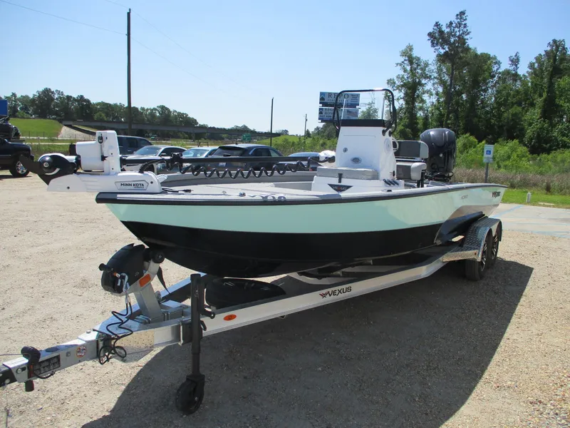 Slide: The Image of 2025 Vexus ACX 2210 boat on trailer in outdoor setting. - 3