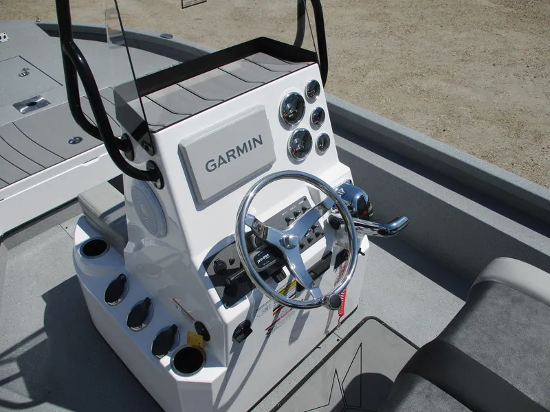 Slide: The Image of 2025 Vexus ACX 2210 boat console with Garmin navigation and steering wheel. - 9