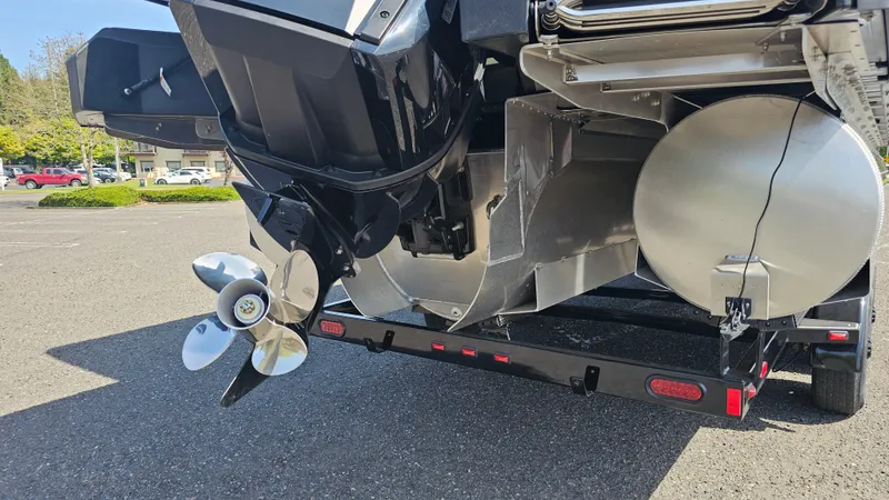 Slide: The Image of 2025 Manitou 24' Explore MAX Deck Navigator with 150hp Rotax Stealth Motor, rear view. - 18