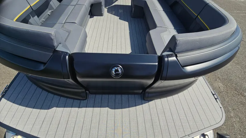 Slide: The Image of 2025 Manitou 24' Explore MAX Deck with sleek seating and 150hp Rotax Stealth Motor. - 26