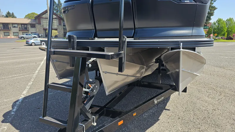 Slide: The Image of 2025 Manitou 24' Explore MAX Deck Navigator with 150hp Rotax Stealth Motor on trailer. - 28