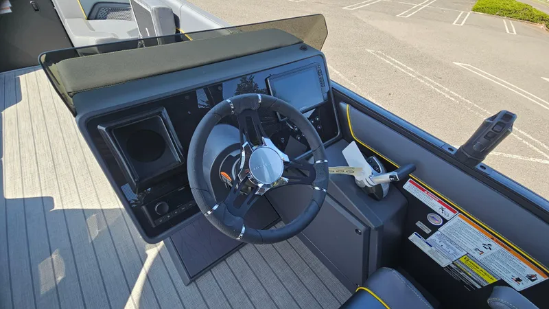 Slide: The Image of 2025 Manitou 24' Explore MAX Deck Navigator dashboard with 150hp Rotax Stealth Motor. - 39