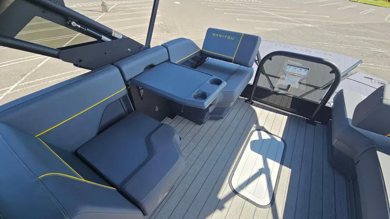 Slide: The Image of 2025 Manitou 24' Explore MAX Deck Navigator with luxurious seating and modern design. - 42