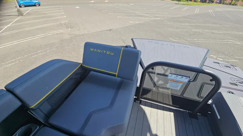Slide: The Image of 2025 Manitou 24' Explore MAX Deck with 150hp Rotax Stealth Motor, featuring sleek seating. - 44
