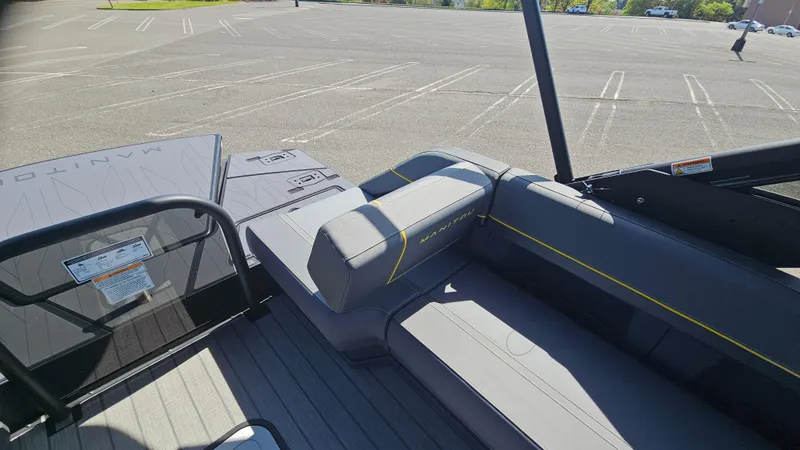 Slide: The Image of 2025 Manitou 24' Explore MAX Deck Navigator with 150hp Rotax Stealth Motor, featuring sleek seating. - 45