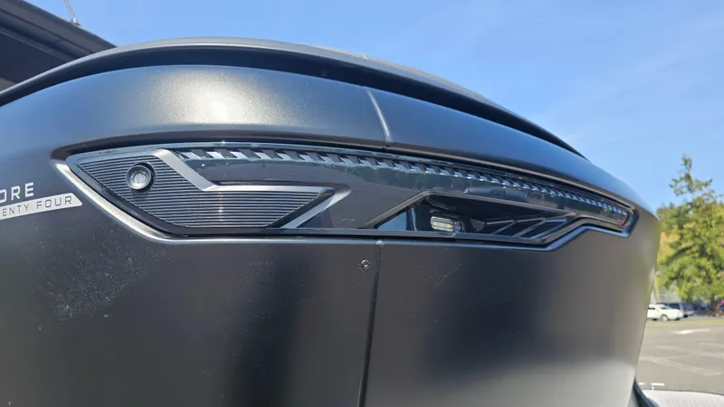 Slide: The Image of 2025 Manitou 24' Explore MAX Deck Navigator with sleek design and 150hp Rotax Stealth Motor. - 49