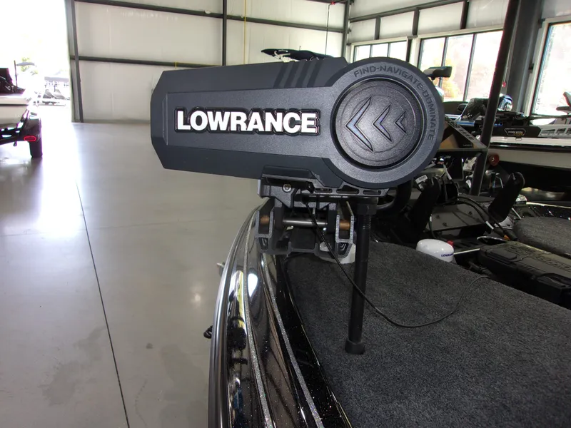 Slide: The Image of Lowrance fish finder on 2025 Skeeter FXR-20 Pro boat in a garage setting. - 11