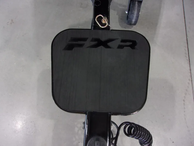 Slide: The Image of 2025 Skeeter FXR-20 Pro trailer hitch with FXR branding on a concrete floor. - 14