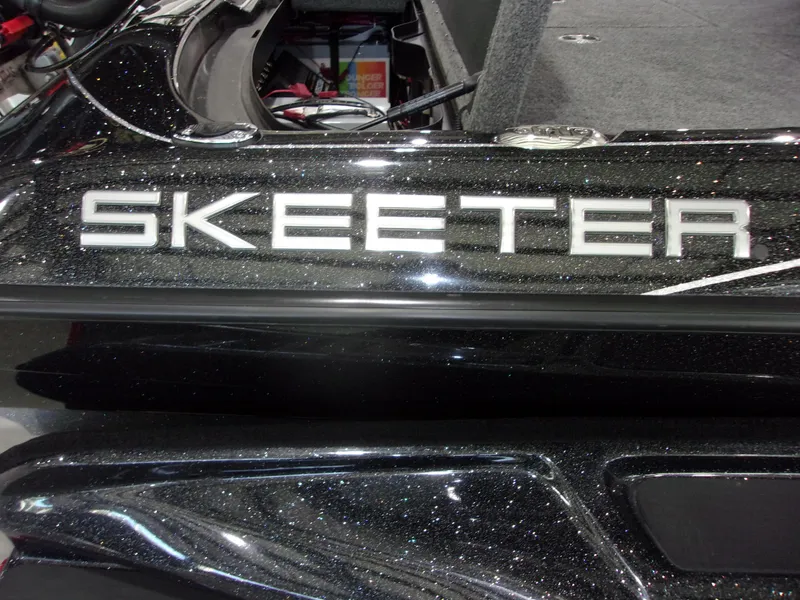 Slide: The Image of 2025 Skeeter FXR-20 Pro boat with sleek black finish and visible logo. - 20