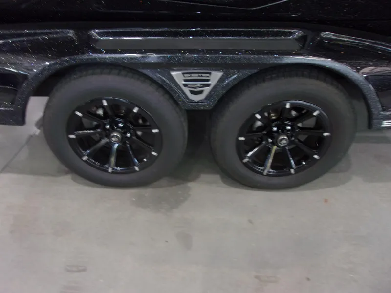 Slide: The Image of 2025 Skeeter FXR-20 Pro trailer with dual black alloy wheels. - 22