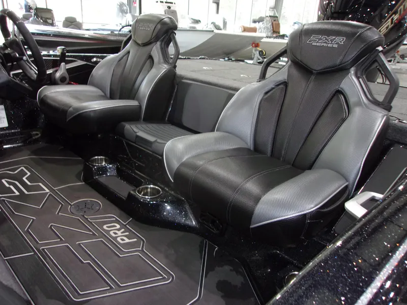 Slide: The Image of 2025 Skeeter FXR-20 Pro interior with sleek black seating and detailed floor design. - 7