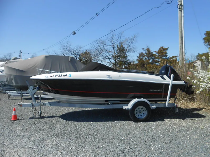 The Image of 2022 Bayliner VR4 Bowrider OB on trailer, parked outdoors on gravel. - 0