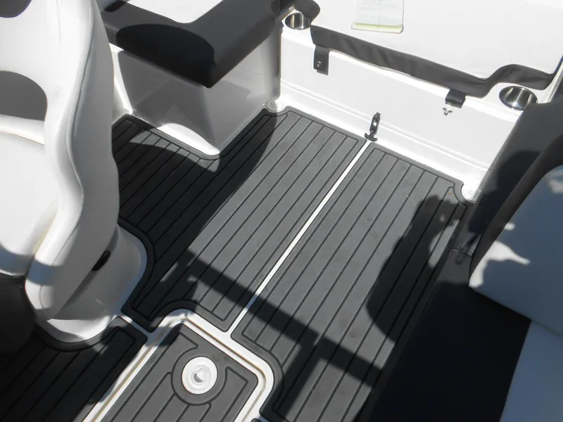 Slide: The Image of 2022 Bayliner VR4 Bowrider OB interior with sleek, modern flooring and seating. - 13
