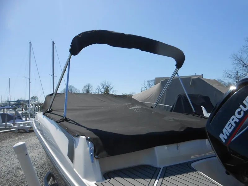 Slide: The Image of 2022 Bayliner VR4 Bowrider OB with black cover and Mercury outboard motor. - 14