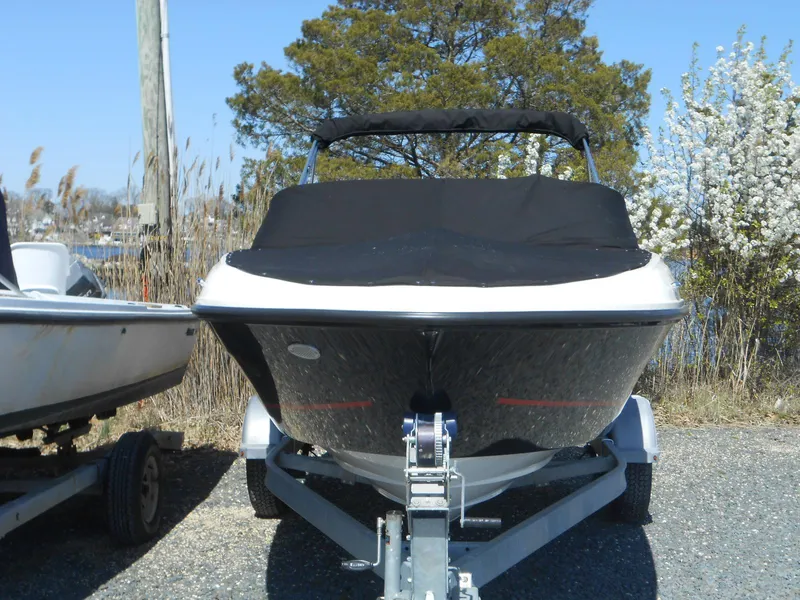 Slide: The Image of 2022 Bayliner VR4 Bowrider OB on trailer, covered, parked outdoors. - 15