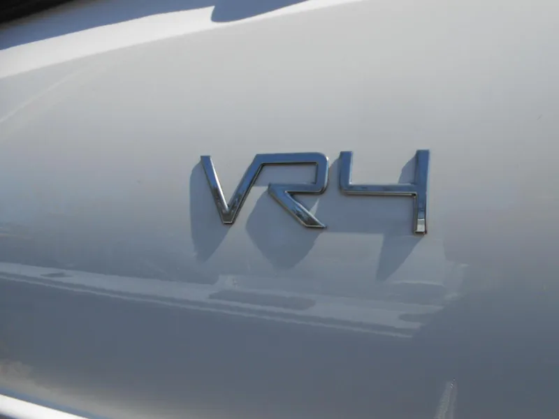 Slide: The Image of 2022 Bayliner VR4 Bowrider OB emblem on white surface. - 2