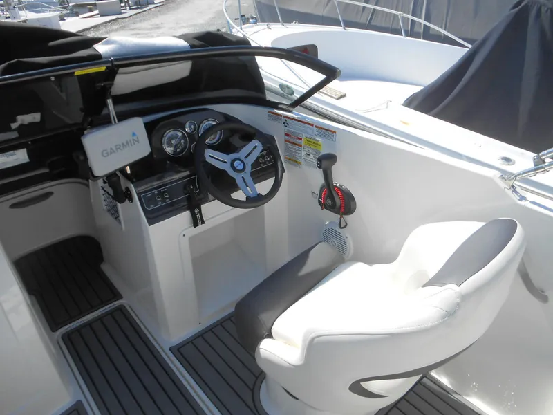 Slide: The Image of 2022 Bayliner VR4 Bowrider OB cockpit with Garmin navigation and comfortable seating. - 4