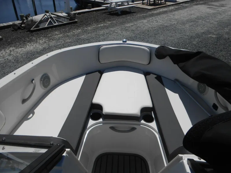 Slide: The Image of 2022 Bayliner VR4 Bowrider OB interior with cushioned seating and cup holders. - 7