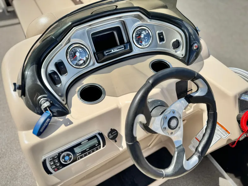 Slide: The Image of Steering console of 2018 Sun Tracker Party Barge 22 DLX with gauges and controls. - 20
