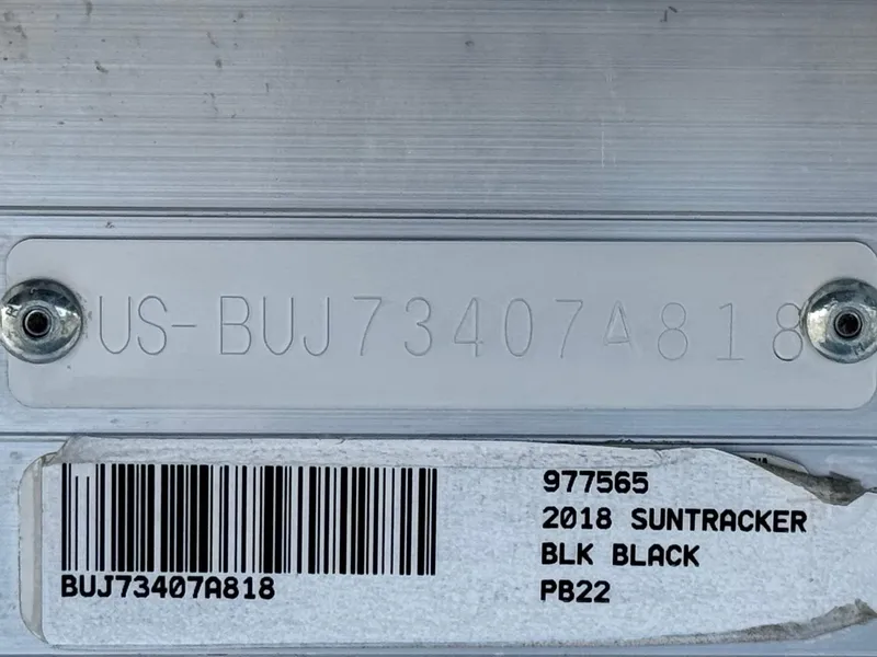 Slide: The Image of 2018 Sun Tracker Party Barge 22 DLX identification plate with serial number and barcode. - 24