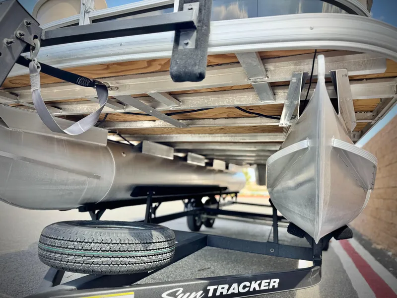 Slide: The Image of 2018 Sun Tracker Party Barge 22 DLX pontoon boat on trailer, underside view. - 3