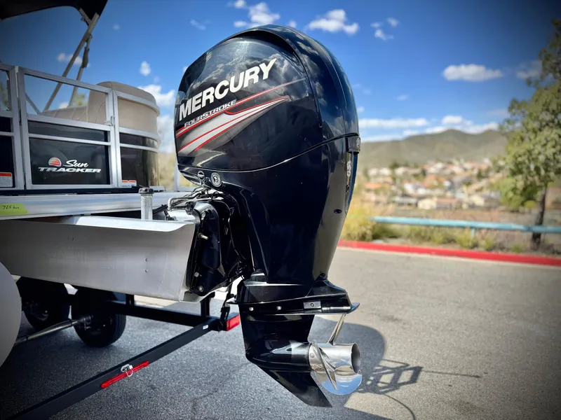 Slide: The Image of 2018 Sun Tracker Party Barge 22 DLX with Mercury outboard motor, parked outdoors. - 7